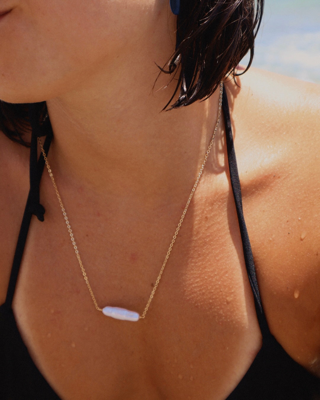 Handmade Biwa Pearl Necklace on a gold-plated chain. Each organic pearl is unique, lightweight, and perfect alone or layered with other necklaces.