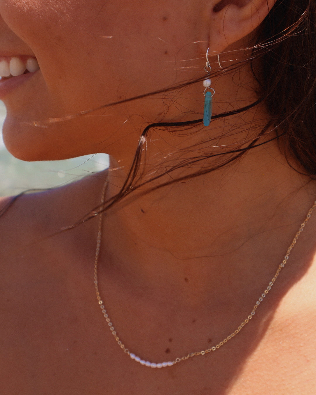Handmade Gioia Sea Glass Earrings featuring genuine white, seafoam, or dark blue sea glass with freshwater pearl accents on gold-filled or sterling silver hooks.