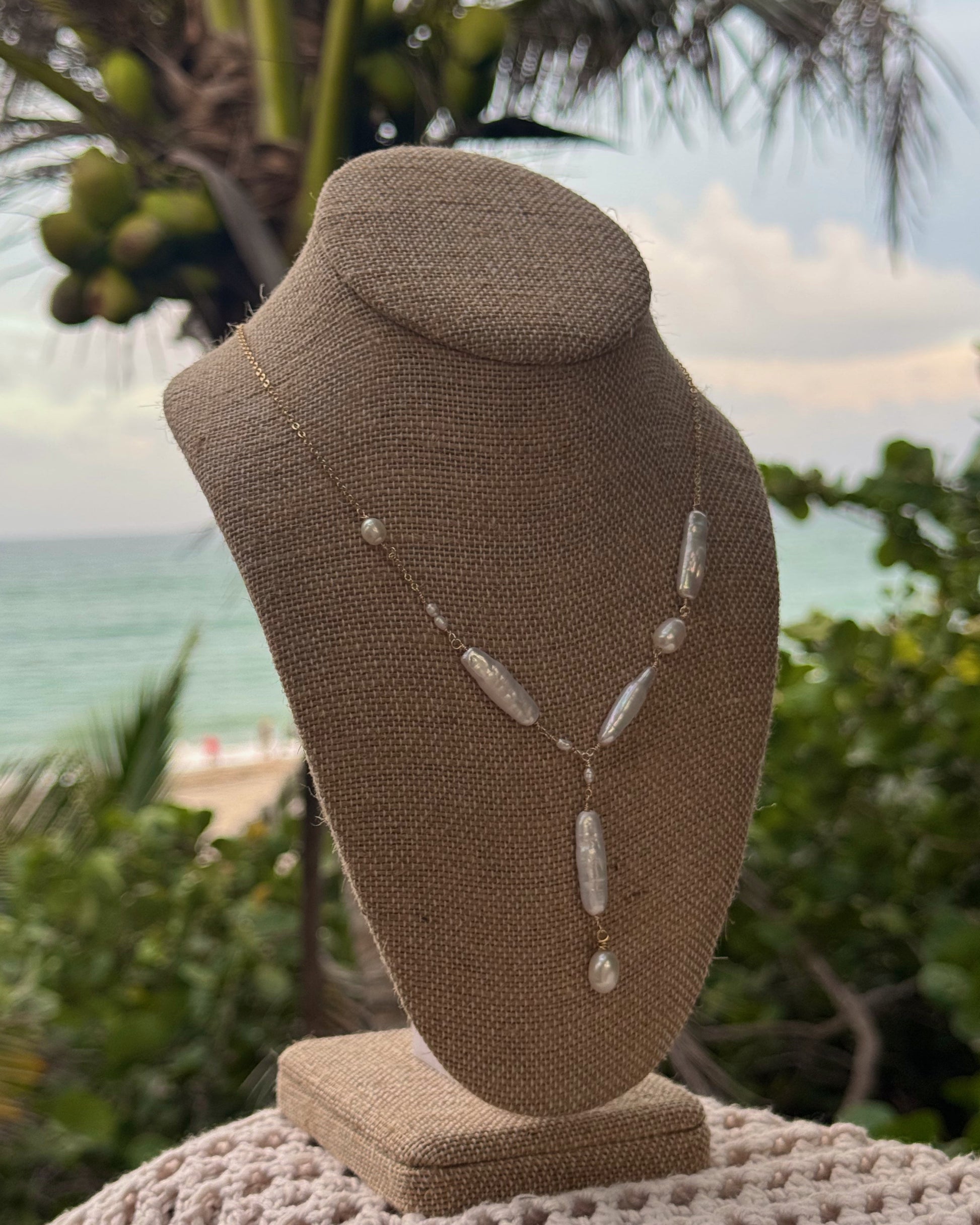 Handmade Thalassa Lariat Pearl Necklace featuring Biwa and freshwater pearls on a gold-plated or sterling chain, dainty Y-shaped design.