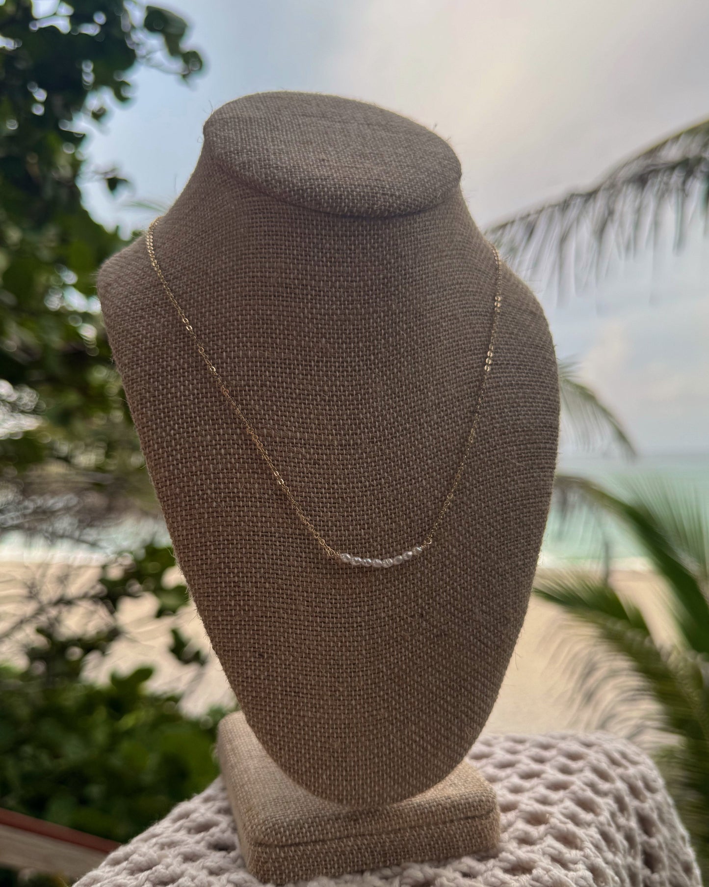 Handmade Isla Pearl Necklace featuring tiny freshwater pearls on 18-inch gold-plated or sterling chain with gold-filled findings, lightweight and dainty.