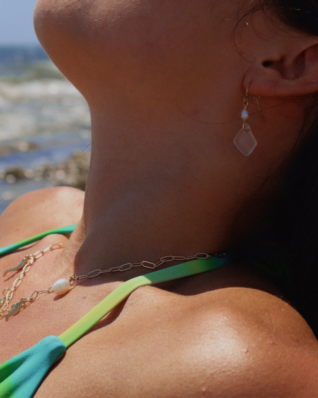 Handmade Gioia Sea Glass Earrings featuring genuine white, seafoam, or dark blue sea glass with freshwater pearl accents on gold-filled or sterling silver hooks.