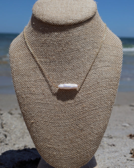 Handmade Biwa Pearl Necklace on a gold-plated chain. Each organic pearl is unique, lightweight, and perfect alone or layered with other necklaces.