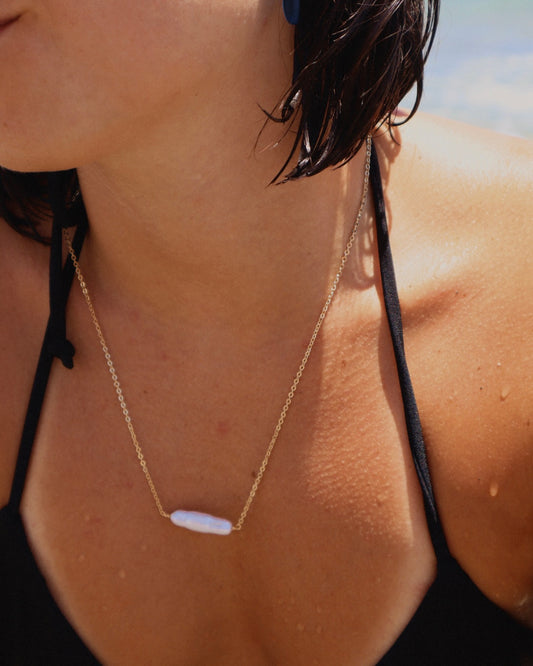 Handmade Biwa Pearl Necklace on a gold-plated chain. Each organic pearl is unique, lightweight, and perfect alone or layered with other necklaces.