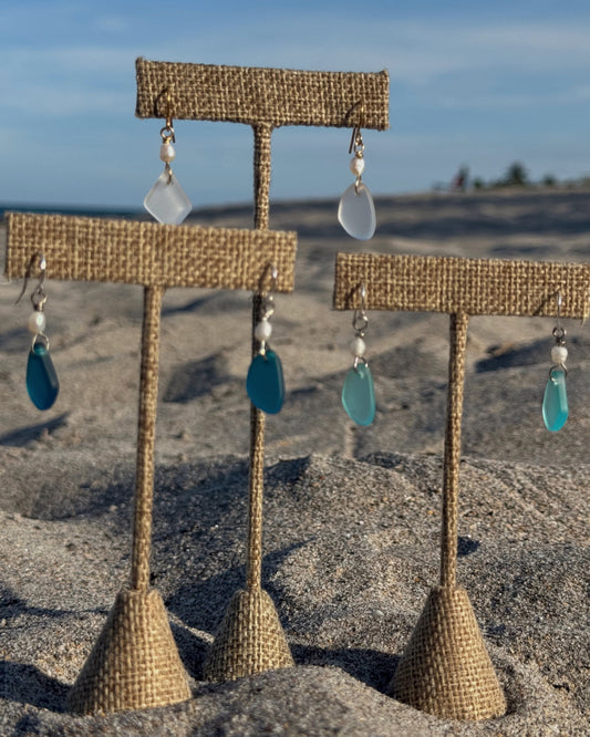 Handmade Gioia Sea Glass Earrings featuring genuine white, seafoam, or dark blue sea glass with freshwater pearl accents on gold-filled or sterling silver hooks.