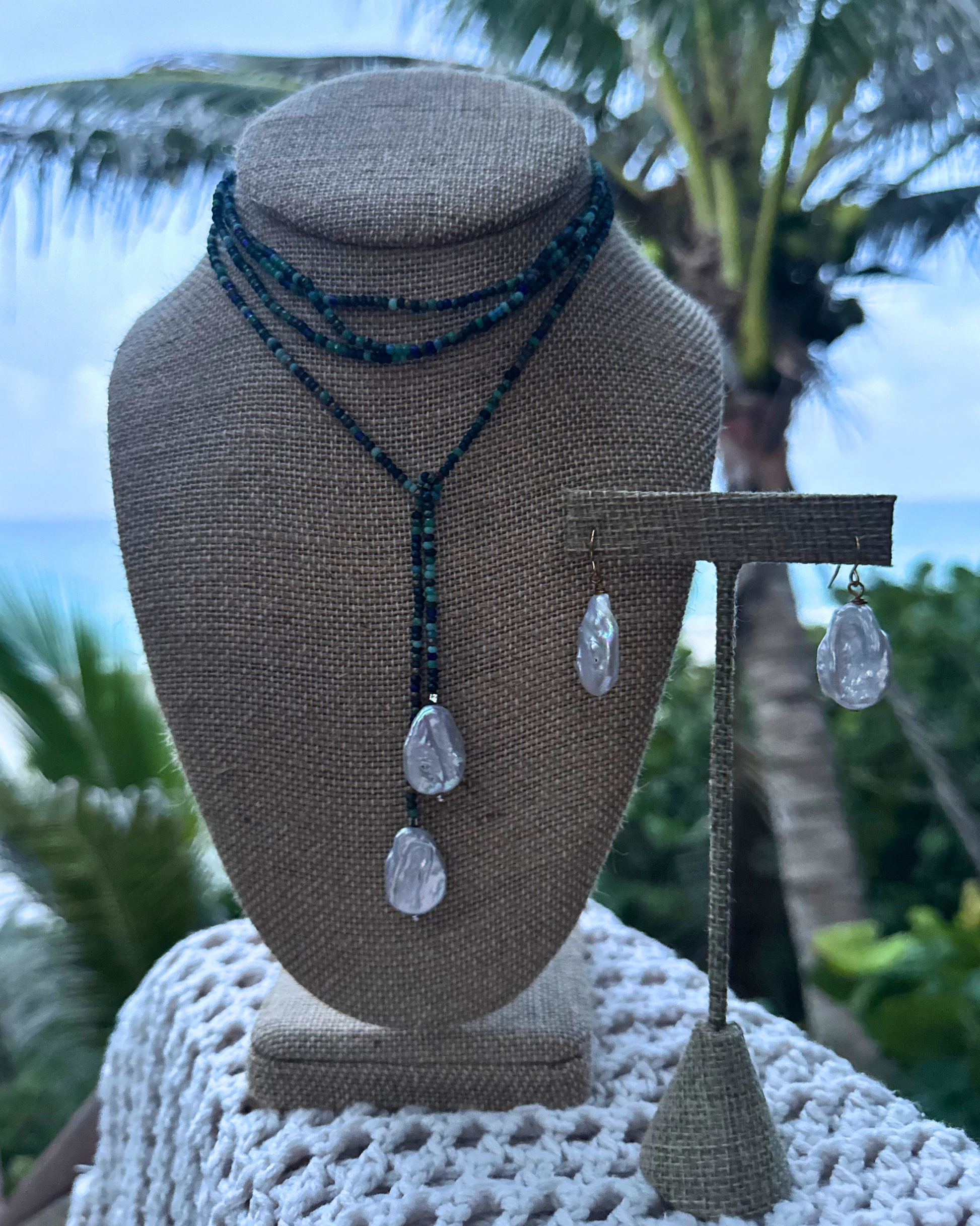 Handmade Lola Necklace featuring mixed blue beads and natural freshwater pearls, lariat style for versatile wear, each necklace unique.